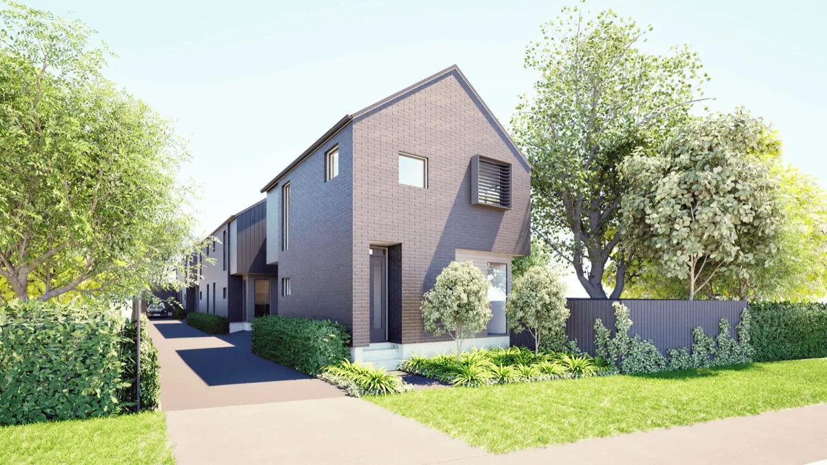 The McLean Townhouses, a row of two-storey brick Fowler Homes townhouses with gabled roofs